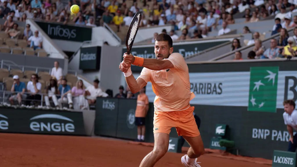 Novak Djokovič v zápase s Joaem Fonsecou
