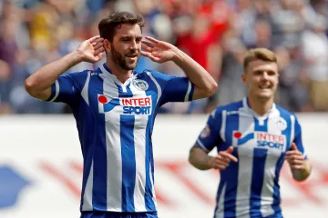 Will Grigg (vlevo) v dresu Wiganu