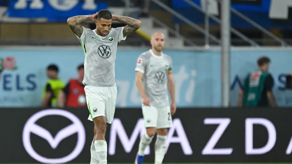 Vinicius Souza a Christian Eriksen (vpravo)