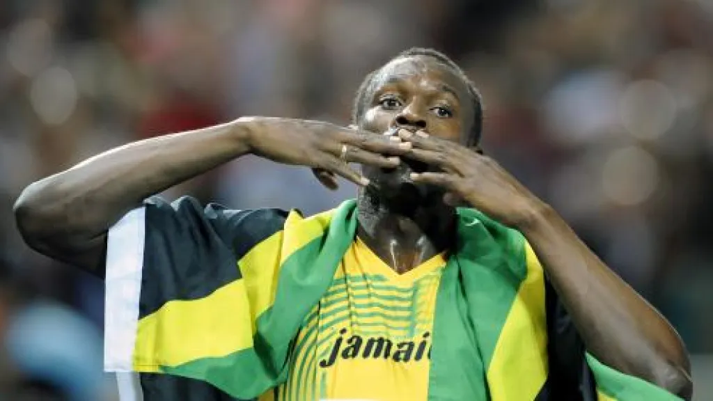 Usain Bolt oslavuje titul i světový rekord