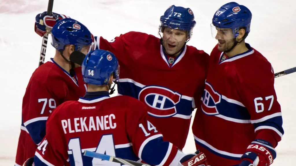 Tomáš Plekanec s hráči Montrealu