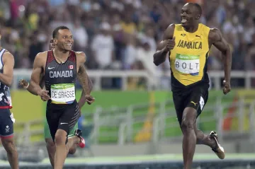 Kanaďan Andre de Grasse a Jamajčan Usain Bolt
