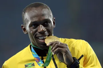 Usain Bolt se zlatou medailí z OH