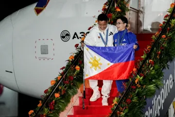 Gymnasta Carlos Yulo (vpravo) a boxerka Nesthy Peteciová