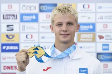 Michal Rada se zlatou medailí z juniorského MS